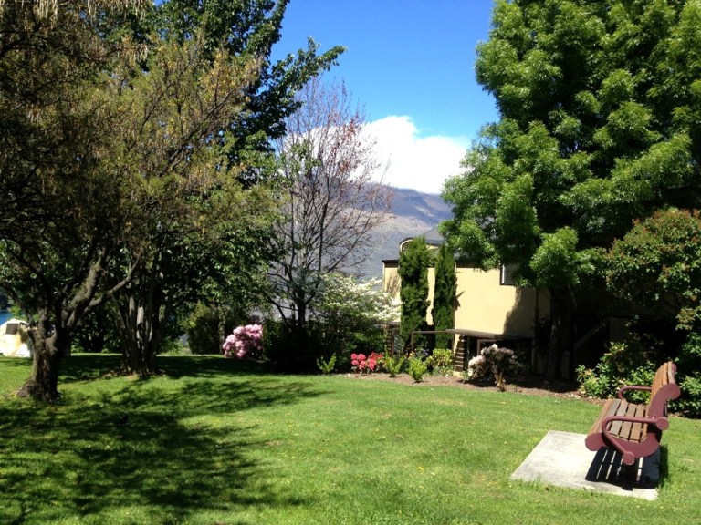 As I jot this, I'm sitting in cool memorial park, birds chirping in delight, leaves swinging rhythmically & the winds blowing, creating a tingle underneathe you. In front of me lies the mystical Lake Wakatipu, situated at the foot of snow capped mountains. There are Scottish-style houses beside the park & bright, colorful flowers to accentuated them -- 11/12/12, 12:13 PM